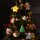 Legami Plüsch-Weihnachtsdekoration SSD0004 zeigt ein Rentierornament frontal, mit roter Nase, Geweih und bunten Details.